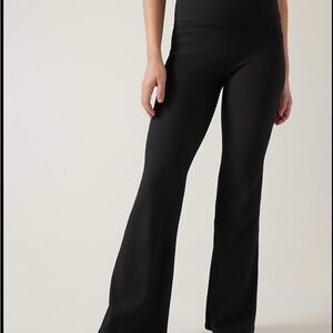 Black Athleta Salutation Stash ribbed flare leggings. Size XS